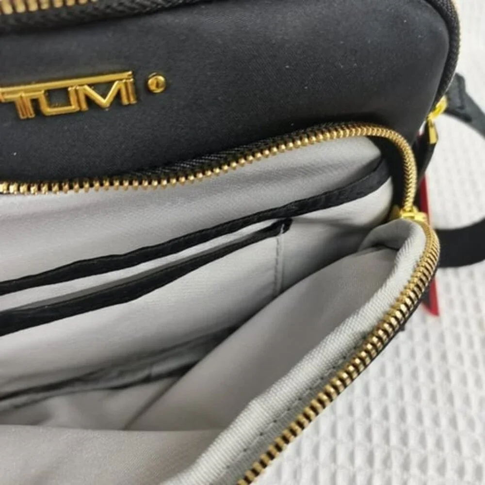 Tumi Voyageur Troy Zip Pocket Crossbody Bag in Black/Gold